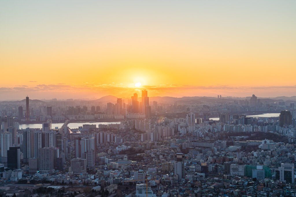 N Seoul Tower winter sunset golden hour view over Seoul skyline from Namsan Park