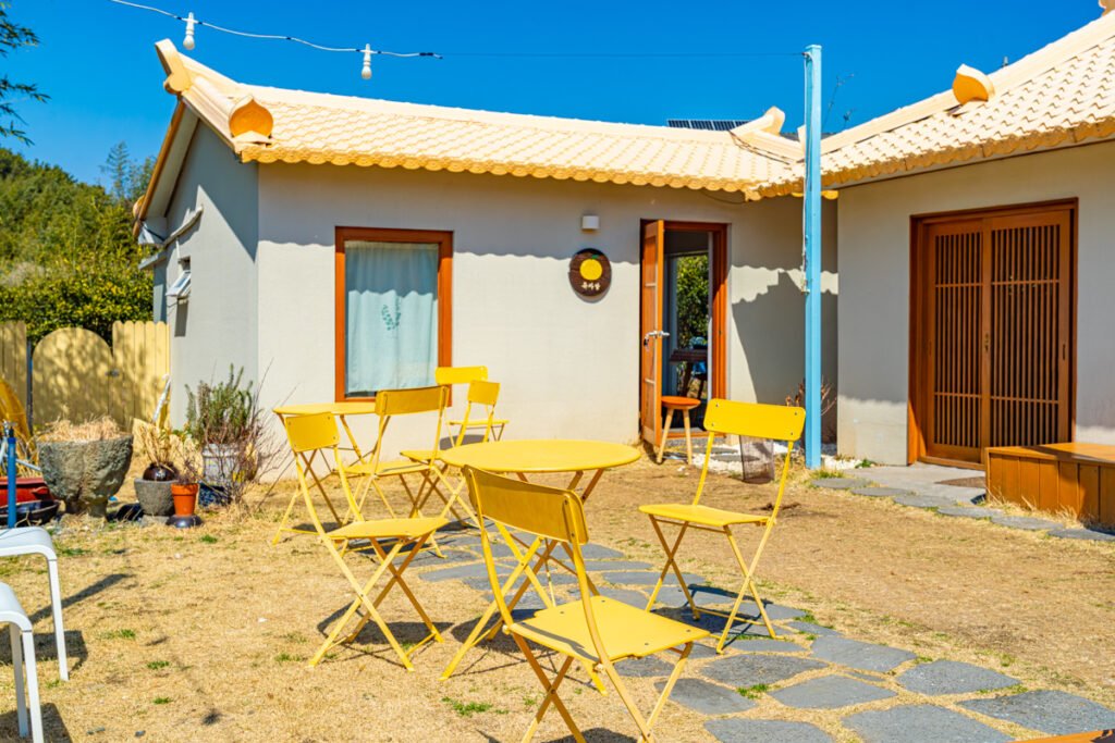 Cafe Yujabat yellow exterior fishing village Geoje spring travel hidden gem